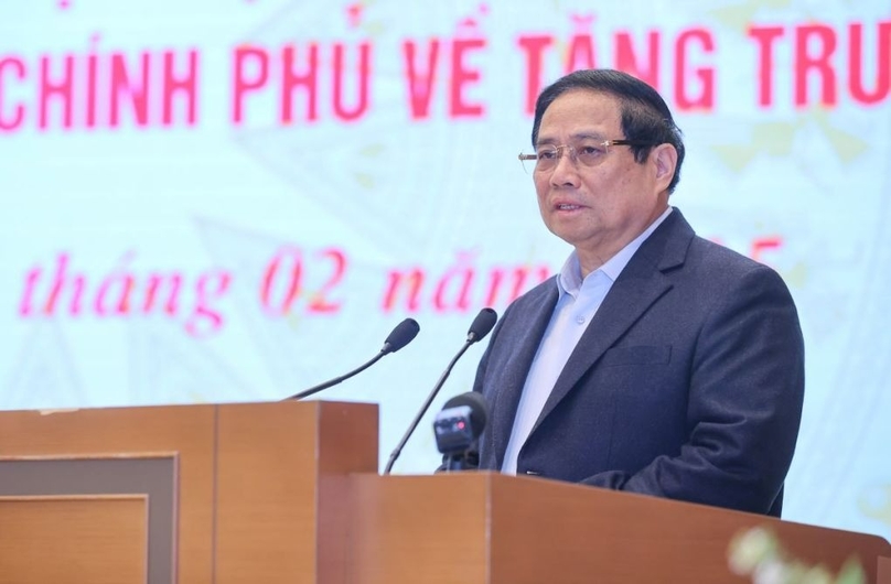 Prime Minister Pham Minh Chinh speaks at a dialogue between the Government and city and provincial leaders on February 21, 2025. Photo courtesy of the government's news portal.