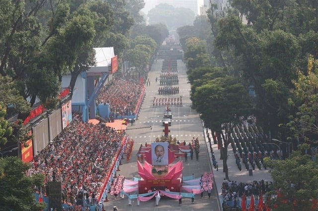 A vehicle carrying the portrait of late President Ho Chi Minh.