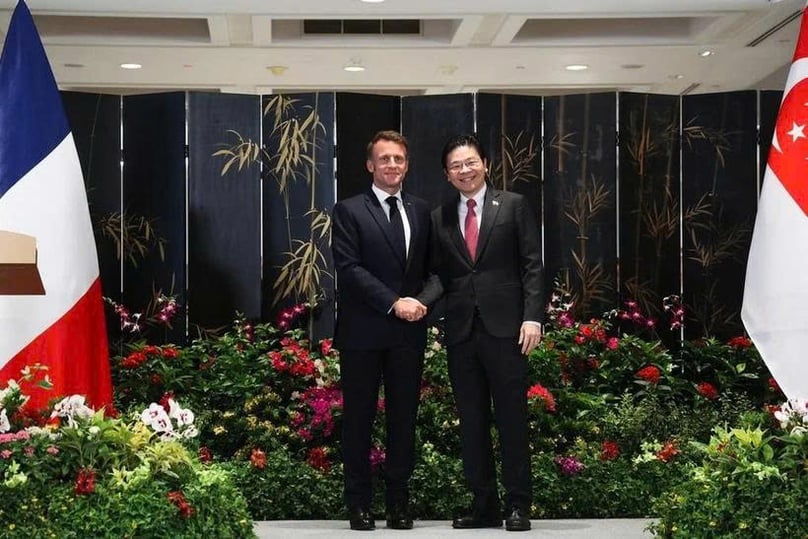 Singaporean Prime Minister Lawrence Wong (right) and French President Emmanuel Macron witness the exchange of 13 agreements at a ceremony in Parliament House on May 30, 2025. Photo courtesy of The Straits Times.