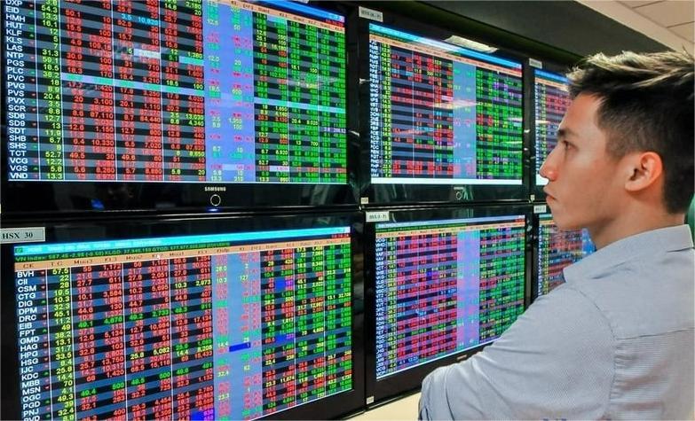 An investor looks at price boards at a securities company in Vietnam. Photo by The Investor/Trong Hieu.