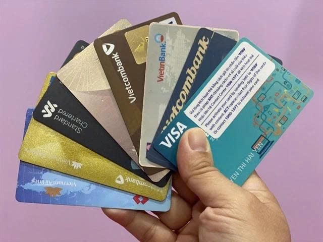 From July 1, all domestic transactions via magnetic‑stripe cards, including the stripe on hybrid chip cards, are switched off. Photo courtesy of VNA.
