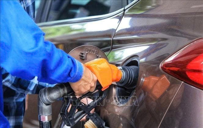 Gasoline pumped into a car in Vietnam. Photo courtesy of VNA.