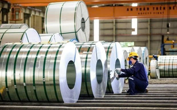 A worker checks steel products. Photo courtesy of VietnamPlus.