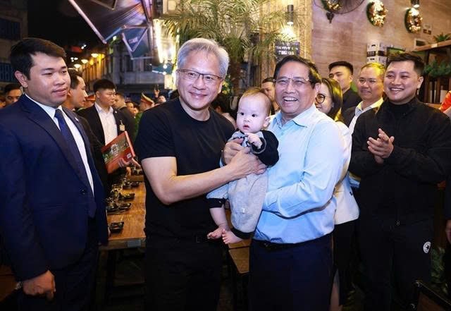 Prime Minister Pham Minh Chinh and Nvidia CEO Jensen Huang visit Hanoi’s Old Quarters during the latter's visit to Vietnam in December 2024. Photo courtesy of Vietnam News Agency.