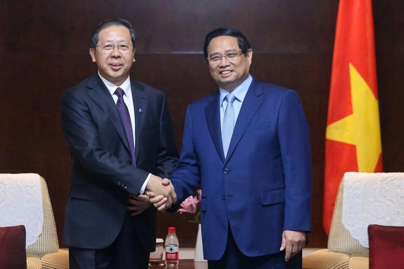 Prime Minister Pham Minh Chinh (right) and Peng Gangping, chairman of China Huadian Engineering Co., Ltd., at their meeting in Tianjin on August 31, 2025. Photo courtesy of the government's news portal.