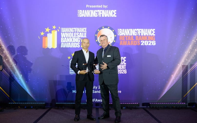 Pham Tran Long, deputy CEO of F88, receives two awards from Nick Atkinson representing the Asian Banking & Finance in Singapore on July 3, 2026. Photo courtesy of F88.
