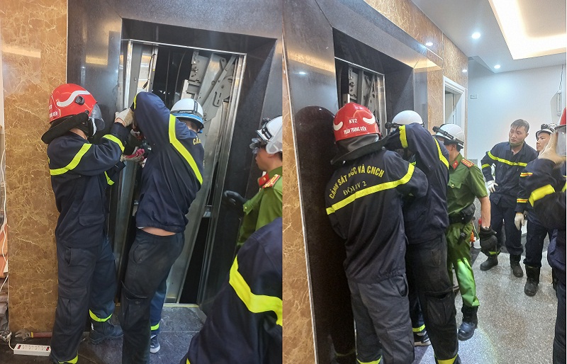 Lực lượng chức năng phá cửa thang máy để đưa nạn nhân ra ngoài.