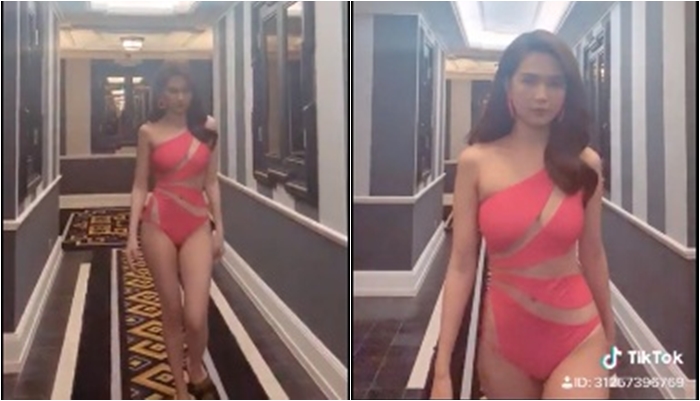 Ngọc Trinh diện bikini cắt xẻ táo bạo catwalk giữa hành lang khách sạn. 