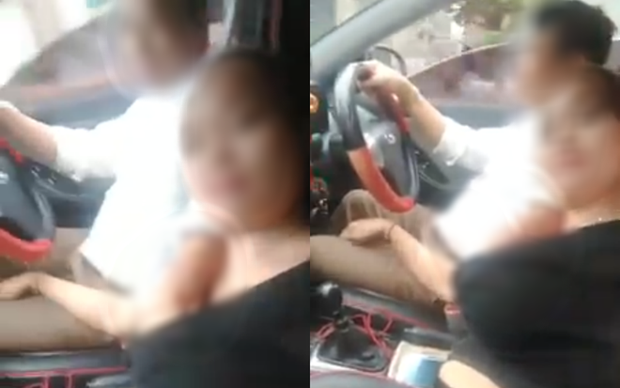 Hình ảnh người đàn ông vừa lái ô tô vừa thò tay sờ soạng trong áo người phụ nữ khiến cư dân mạng bức xúc. (Ảnh: Cắt từ clip).