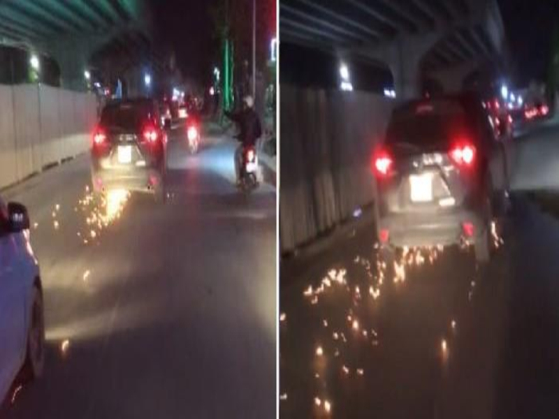Hình ảnh chiếc ô tô gây tai nạn kéo xe đạp điện tóe lửa bỏ chạy trên đường Phạm Văn Đồng.