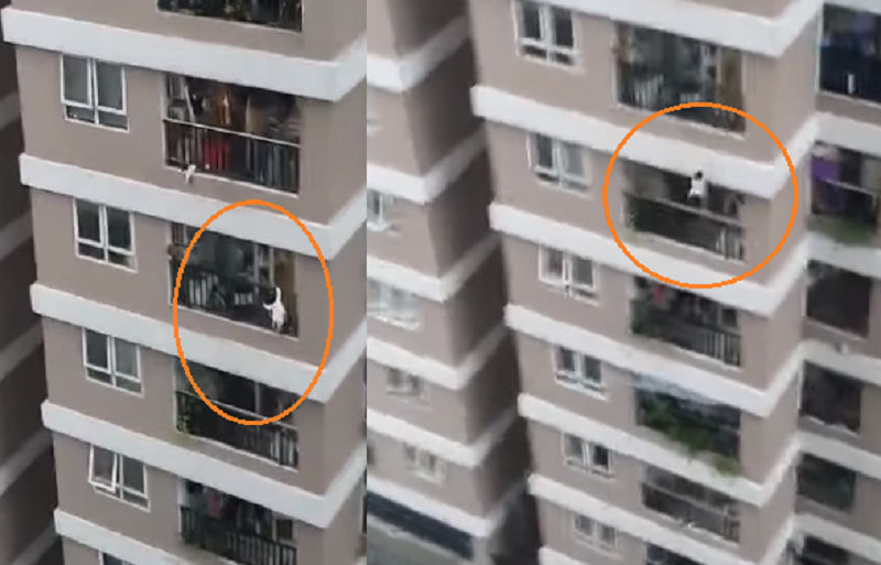 Hình ảnh cháu bé 3 tuổi rơi ban công tầng 12 chung cư, may mắn được cứu sống. (Ảnh cắt từ clip do người dân ghi lại).