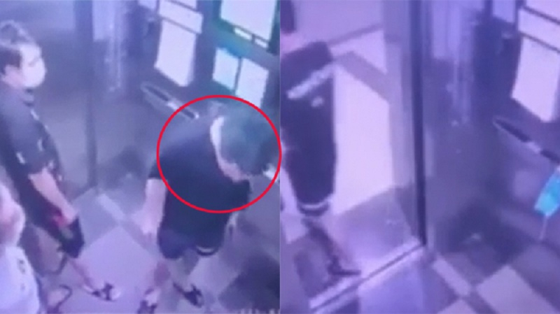 Hình ảnh nam thanh niên khạc nhổ trong thang máy bị camera ghi lại. (Ảnh: Cắt từ clip).