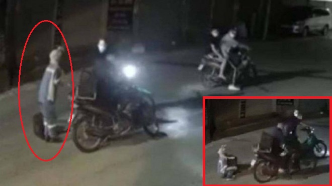 Hình ảnh nữ lao công bị 4 tên cướp cướp xe máy khi đi gom rác ban đêm.