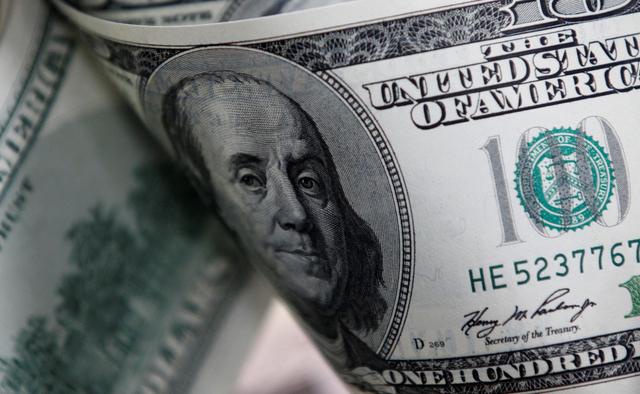 Giới chuyên gia chia rẽ về biến động của đồng USD trong năm 2021. Ảnh: Reuters.