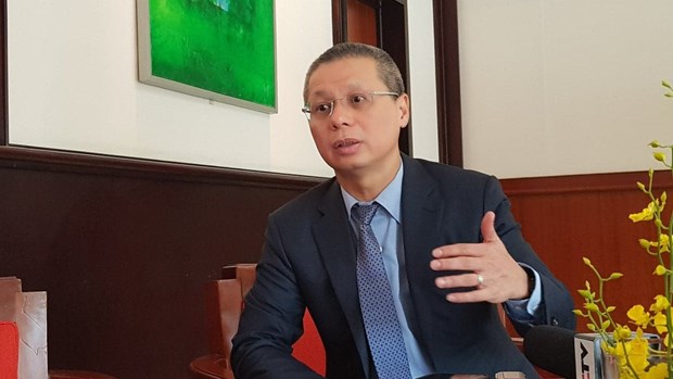 Tổng Giám đốc Techcombank Nguyễn Lê Quốc Anh trong một cuộc trả lời phỏng vấn báo chí. (Ảnh: T.H/Vietnam+).