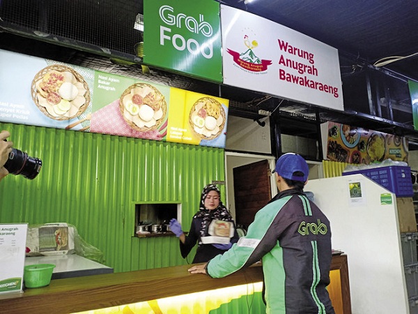 Grab xây dựng mô hình GrabKitchen tại Jakarta, Indonesia vào tháng 9/2018 và cho đối tác thuê nhà bếp để nấu và bán món ngon trên GrabFood. Tuy nhiên, mô hình này đã không được thử nghiệm tại TP.HCM. (Ảnh: ABS-CBN News).