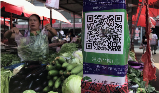 Quầy thực phẩm cho phép thanh toán điện tử tại một khu chợ ở Trung Quốc. Ảnh: Simon Song.