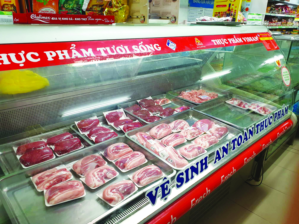 Các cửa hàng của doanh nghiệp lớn tại TP.HCM đang tích cực giữ giá thịt heo và bình ổn thị trường dịp Tết. (Ảnh: Hiếu CT).