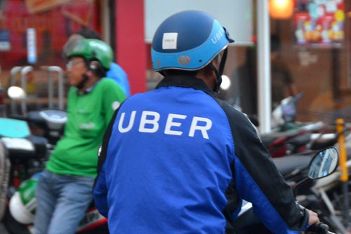 Uber đã chính thức sáp nhập vào Grab từ ngày 9-4Ảnh: Tấn Thạnh