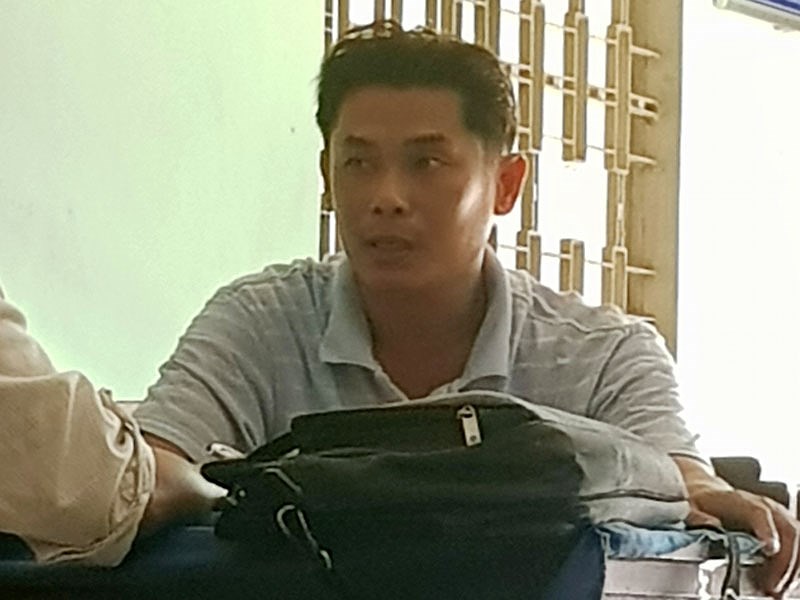 Ông Đỗ Bùi Trung Thảo - Phó giám đốc công ty nông sản Tiền Giang đến Công an đầu thú.    