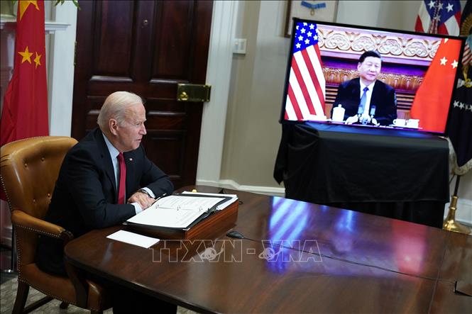 Tổng thống Mỹ Joe Biden và Chủ tịch Trung Quốc Tập Cận Bình trong cuộc gặp trực tuyến ngày 15/11/2021. Ảnh: AFP/TTXVN