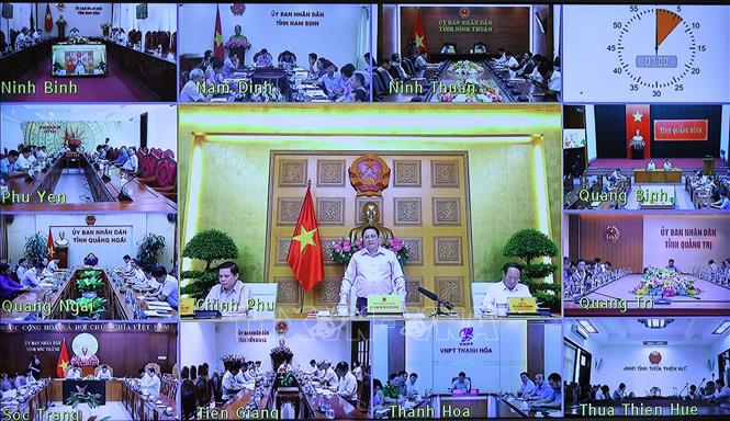 Thủ tướng Phạm Minh Chính chủ trì hội nghị tại điểm cầu Chính phủ. Ảnh: Dương Giang/TTXVN