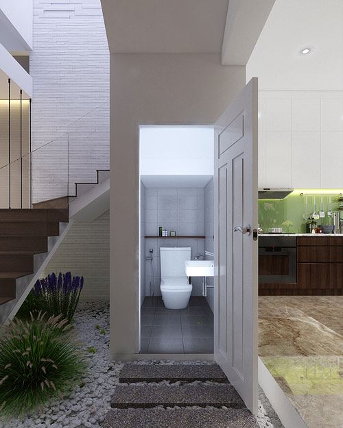 Phòng vệ sinh phân chia ranh giới giữa phòng khách và bếp.