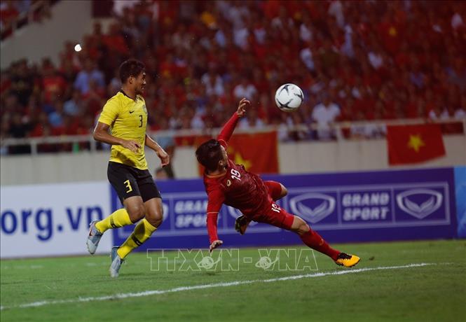 Quang Hải ăn mừng sau khi ghi bàn mở tỉ số cho đội tuyển Việt Nam. Ảnh: TTXVN