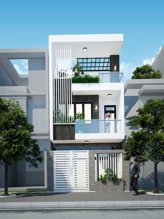 Nhà được thiết kế theo phong cách hiện đại, có tầng tum ngập sắc xanh. Ảnh: Noithatduongdai.