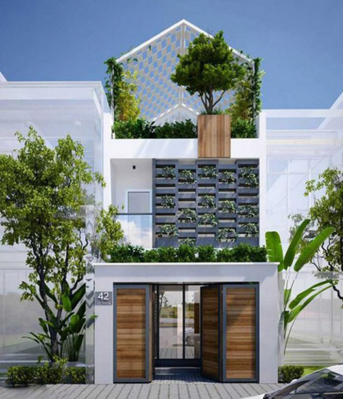 Thiết kế mặt tiền thoáng đan xen hệ thống cây xanh tiểu cảnh trở thành đặc điểm nổi bật của nhà phố. Ảnh: Wedo.