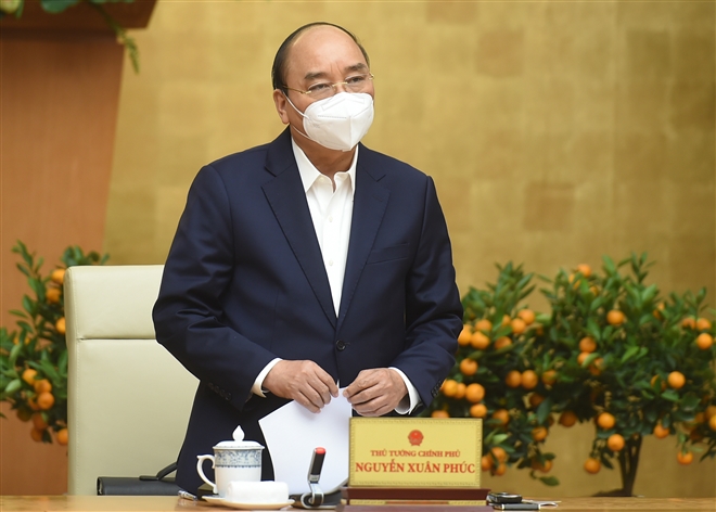 Thủ tướng Nguyễn Xuân Phúc chủ trì cuộc họp Thường trực Chính phủ về phòng chống COVID-19. (Ảnh: VGP)