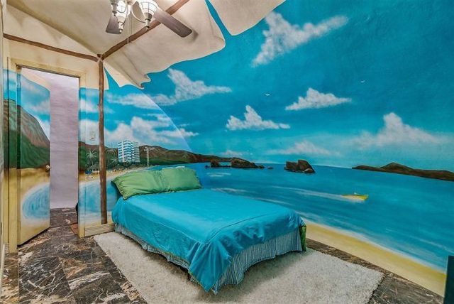  Đây là một phòng ngủ mang phong cách nhiệt đới.