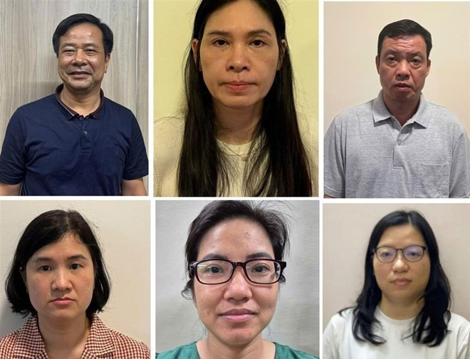 Bị can Nghiêm Quốc Hưng và vợ là Phạm Thị Hạnh (từ trái qua, hàng trên cùng) và 4 người liên quan trong vụ án bị bắt, khởi tố trước đó. Ảnh: Bộ Công an