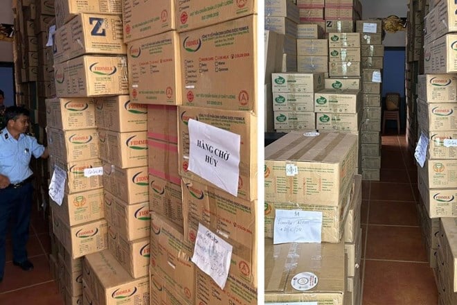   Cơ quan chức năng lập biên bản, tạm giữ toàn bộ 11.856 lon sữa bột, tương đương khoảng 25 tấn, được đóng trong 963 thùng giấy - Ảnh: Báo Lao Động