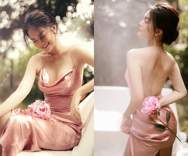 Phạm Quỳnh Anh e ấp, gợi cảm trong thiết kế váy lụa hai dây màu hồng champagne.